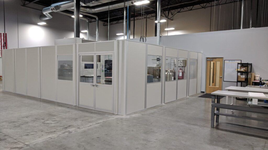 Free standing wall partition in white creates break area inside factory