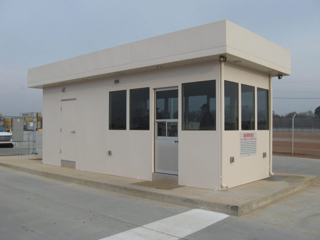 Security building with factory installed restroom