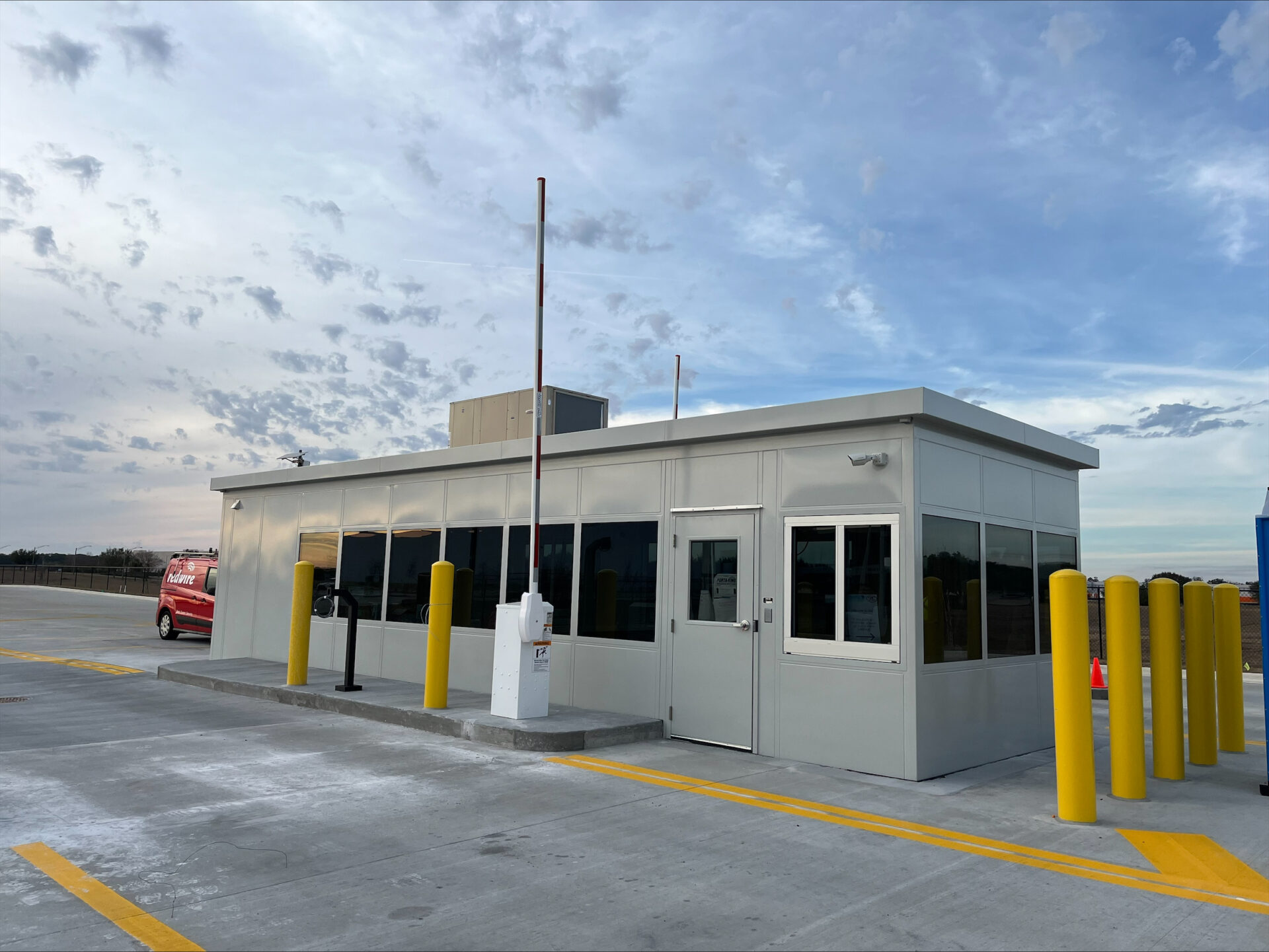 a building with windows and a parking lot