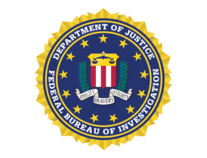 Official seal of the federal bureau of investigation (fbi) featuring a central crest with a shield and scales, surrounded by a gold starburst and the words "fidelity, bravery, integrity.