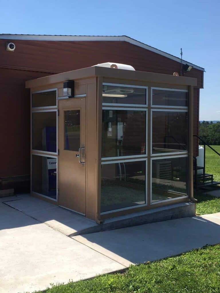 brown equipment shelter with windows