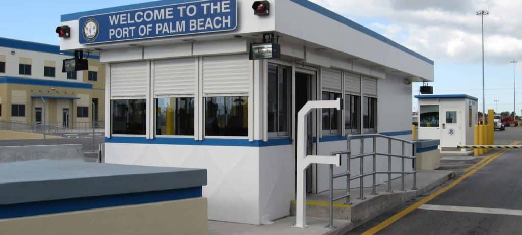 Guard/Security Booth 2 A security checkpoint at the port of palm beach, featuring a white security booth with blue trim, labeled
