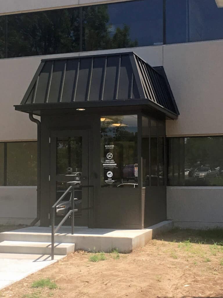 Entry vestibule with hip style roof