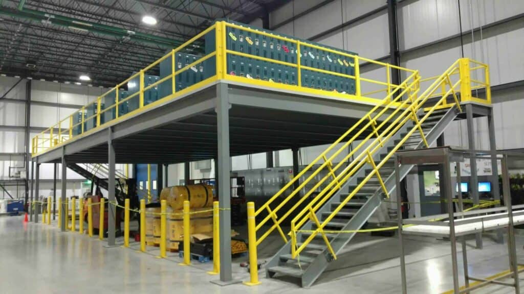 a steel storage mezzanine with yellow safety railing
