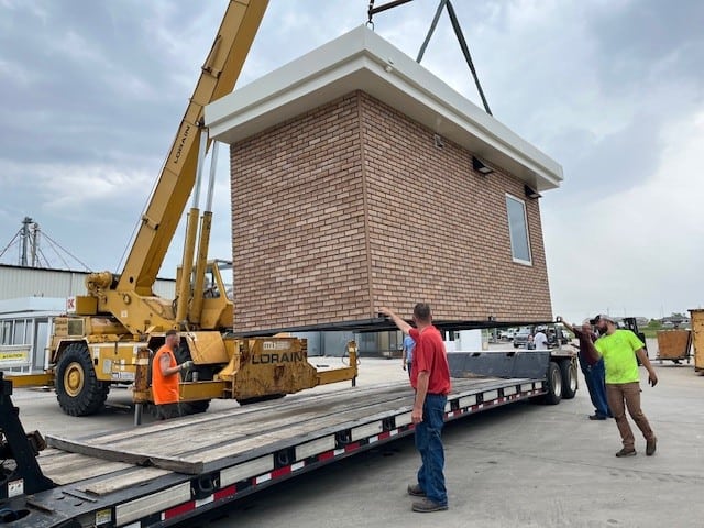 Delivering a guard booth with brick exterior